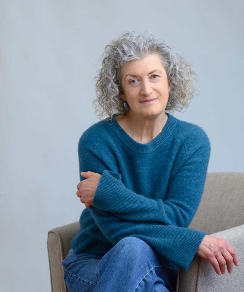 Sheila headshot teal